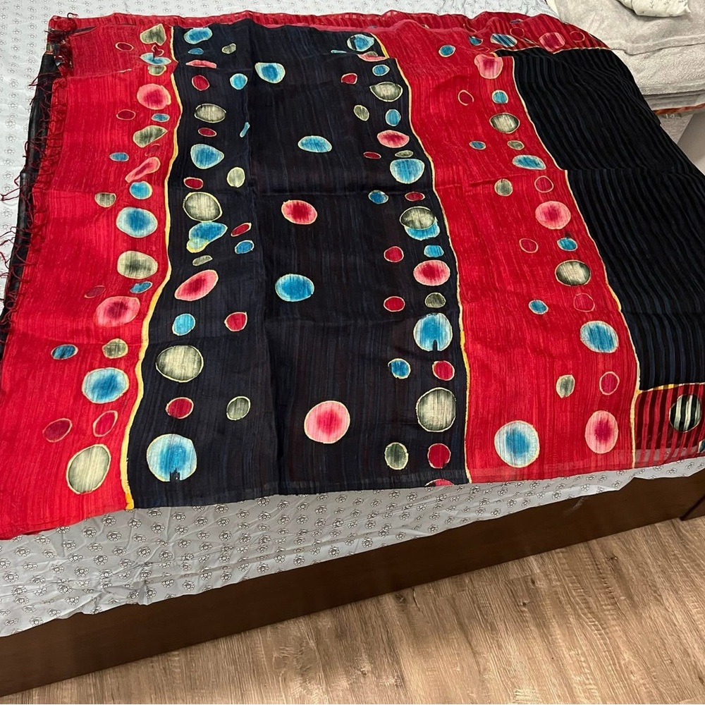 Vibrant Red and Black Saree with Circular Patterns